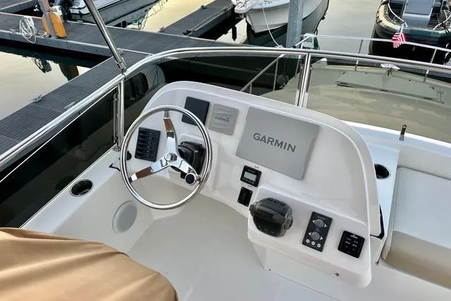 Topcat Yacht Photos Pics Cockpit of 2022 Aspen C120 boat with Garmin navigation system at marina.