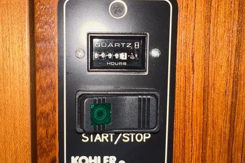 Topcat Yacht Photos Pics Close-up of a Kohler engine control panel with hour meter and start/stop switch.