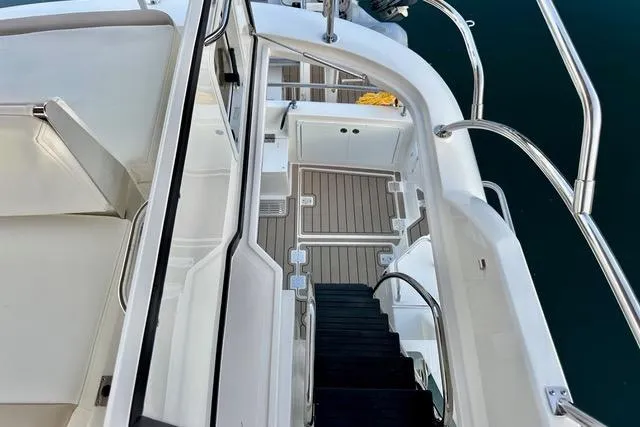 Topcat Yacht Photos Pics 2022 Aspen C120 boat interior with sleek white seating and modern design.
