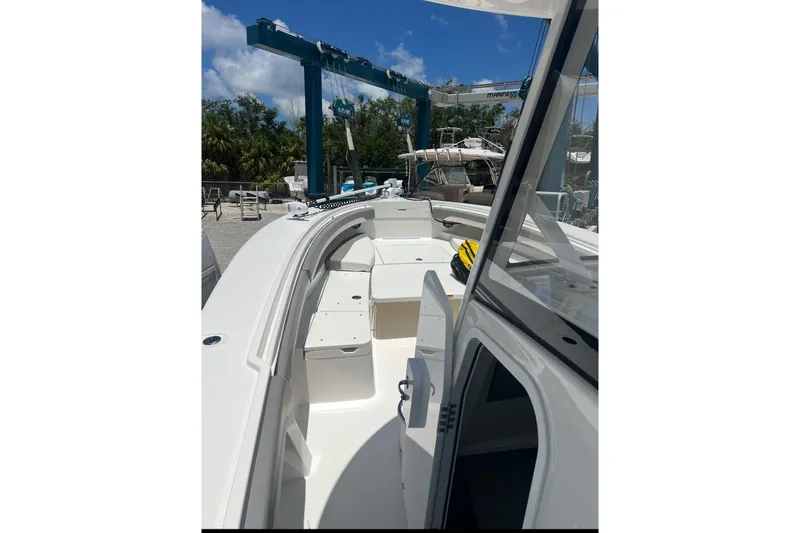34 Regulator Yacht Photos Pics 2024 Regulator 34 C boat interior with open deck and seating under clear blue sky.