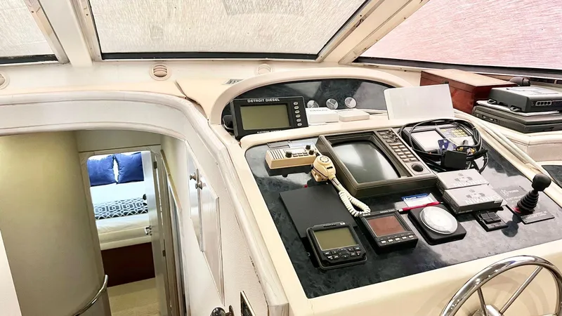  Yacht Photos Pics Neptunus 58 Flybridge 1995 yacht helm with navigation equipment and cabin view.