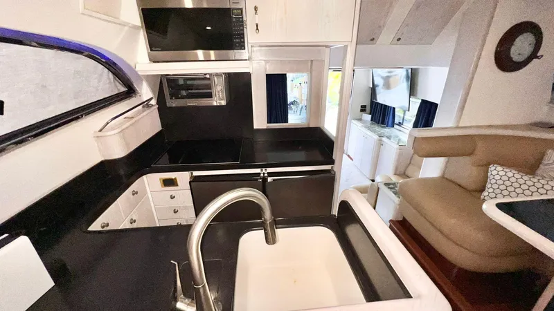  Yacht Photos Pics Interior of 1995 Neptunus 58 Flybridge yacht kitchen with modern appliances.