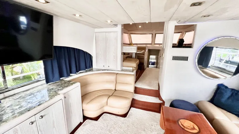  Yacht Photos Pics Luxurious interior of 1995 Neptunus 58 Flybridge yacht with modern furnishings.