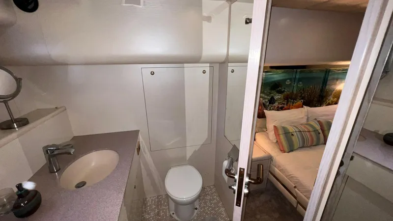  Yacht Photos Pics Neptunus 58 Flybridge 1995 yacht interior with bathroom and cozy bedroom.