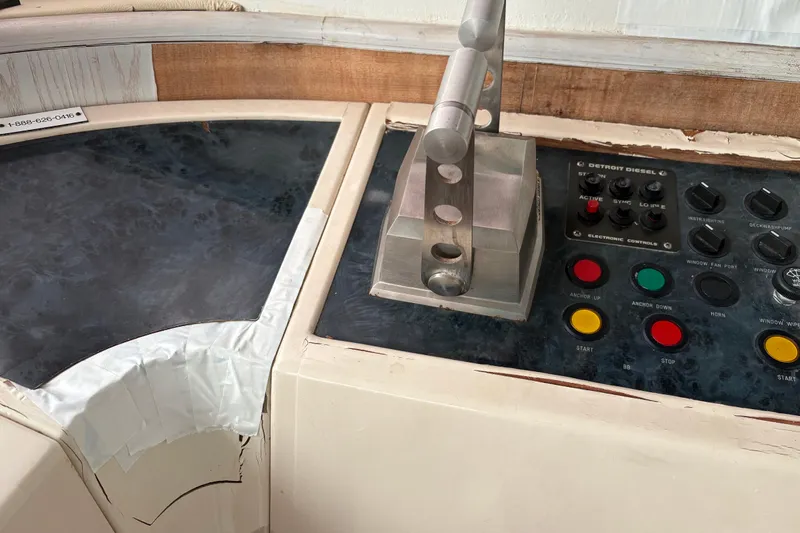  Yacht Photos Pics Control panel of a 1995 Neptunus 58 Flybridge yacht with various buttons and levers.