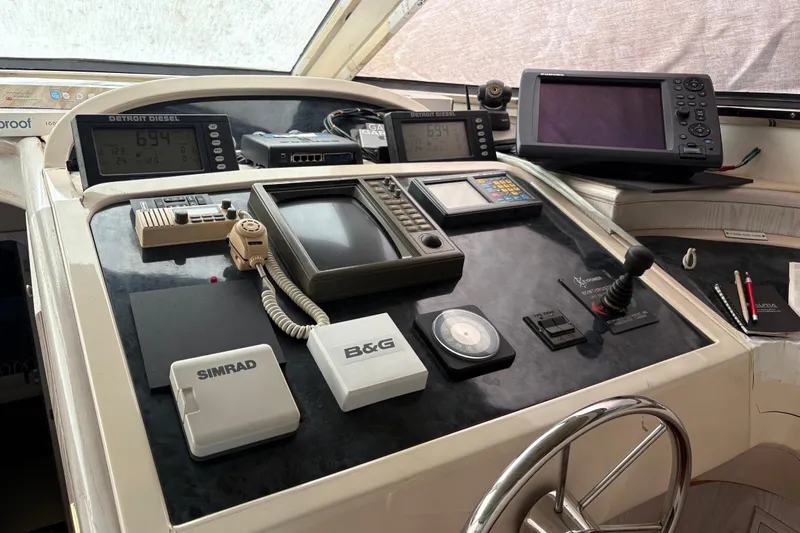  Yacht Photos Pics Control panel of a 1995 Neptunus 58 Flybridge yacht with navigation equipment.