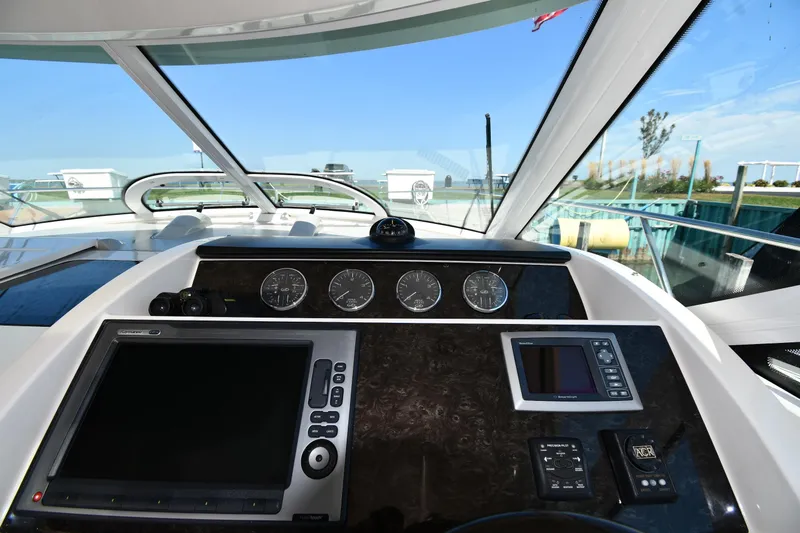 Land Shark Yacht Photos Pics Helm of 2010 Sea Ray 450 Sundancer with navigation instruments and gauges.