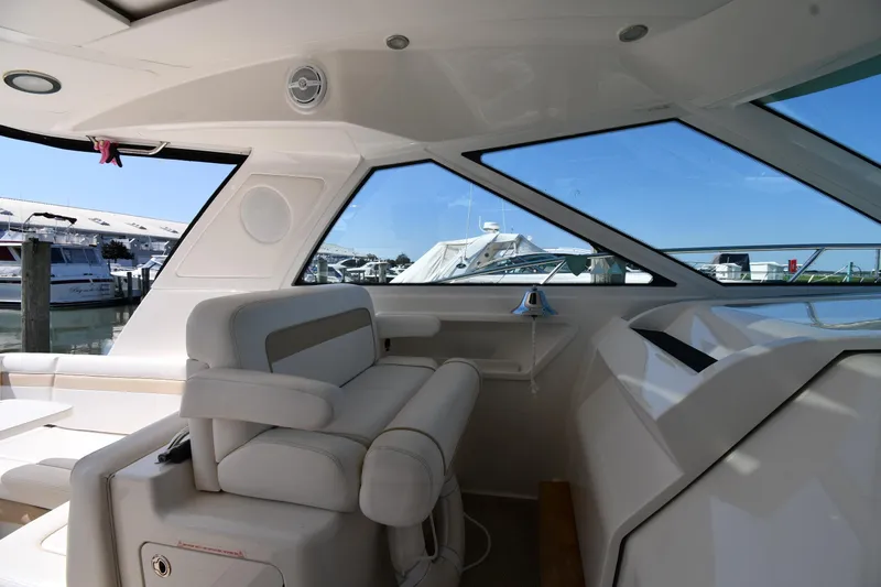 Land Shark Yacht Photos Pics Interior view of 2010 Sea Ray 450 Sundancer yacht, featuring sleek seating and large windows.
