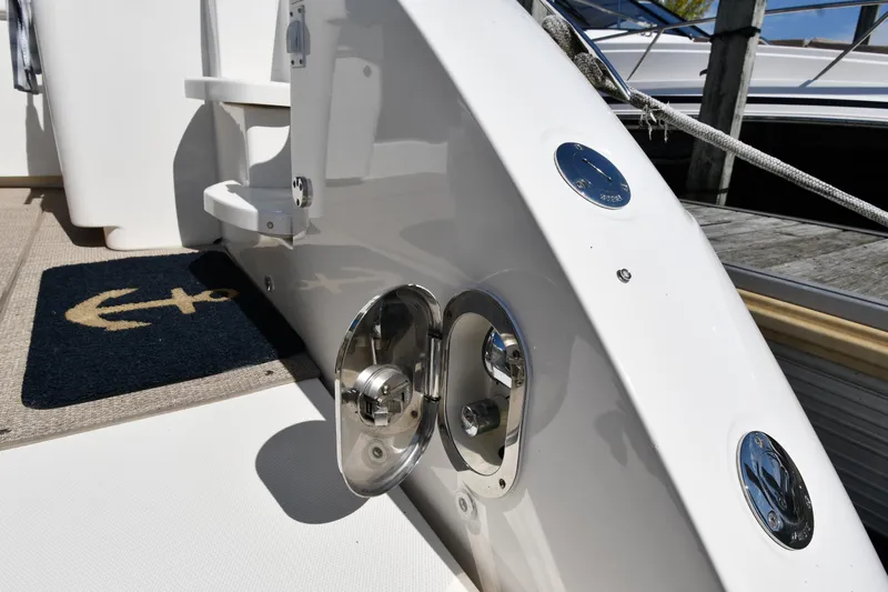 Land Shark Yacht Photos Pics 2010 Sea Ray 450 Sundancer yacht deck with chrome fittings and anchor-themed mat.