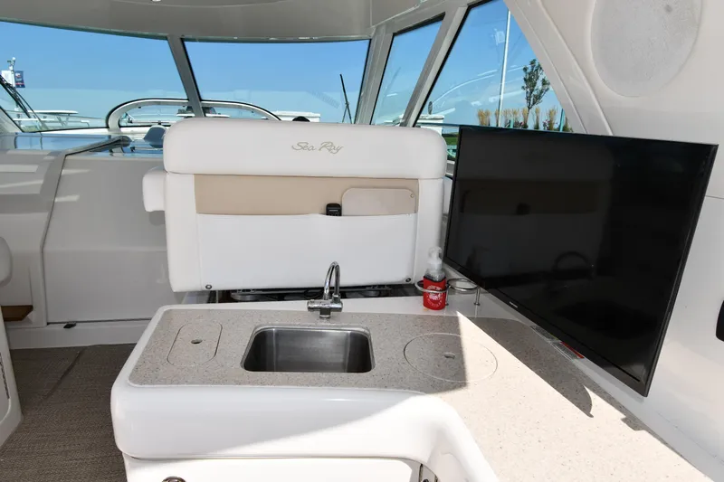 Land Shark Yacht Photos Pics Interior of 2010 Sea Ray 450 Sundancer with sink and TV.