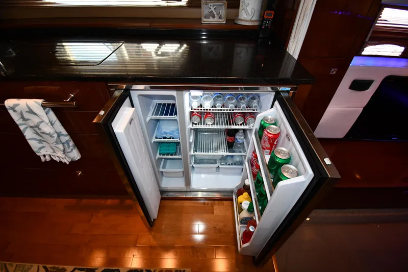 Land Shark Yacht Photos Pics Open mini fridge in 2010 Sea Ray 450 Sundancer yacht, stocked with beverages.
