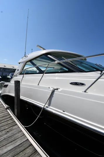 Land Shark Yacht Photos Pics 2010 Sea Ray 450 Sundancer yacht docked under clear blue sky.