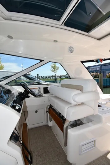Land Shark Yacht Photos Pics Interior of 2010 Sea Ray 450 Sundancer yacht with modern helm and seating.