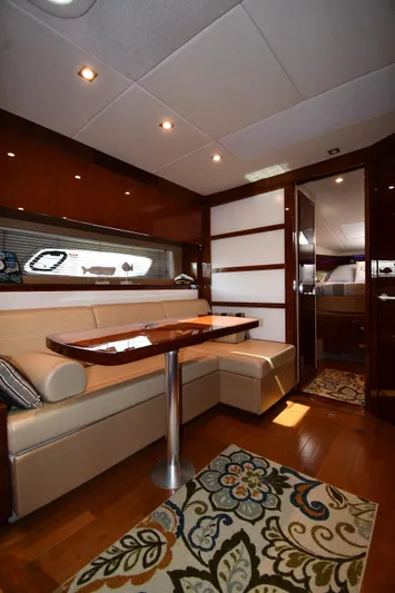 Land Shark Yacht Photos Pics Luxurious interior of 2010 Sea Ray 450 Sundancer yacht with elegant seating and decor.