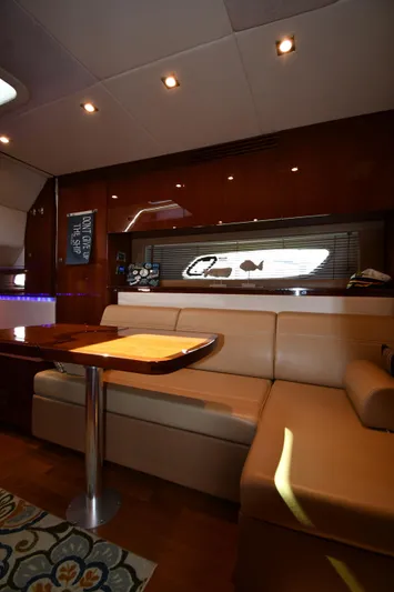 Land Shark Yacht Photos Pics Interior of 2010 Sea Ray 450 Sundancer yacht with elegant seating and modern decor.