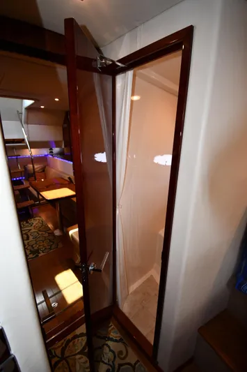 Land Shark Yacht Photos Pics Interior view of 2010 Sea Ray 450 Sundancer yacht with elegant wooden door.