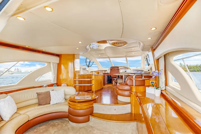  Yacht Photos Pics Luxurious interior of a 2005 Azimut 55E yacht with elegant seating and panoramic windows.