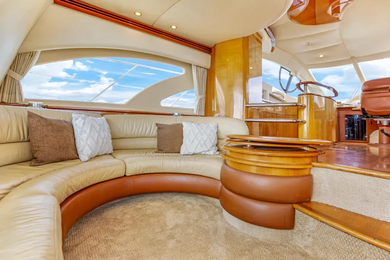  Yacht Photos Pics Luxurious interior of a 2005 Azimut 55E yacht with elegant seating and wooden accents.
