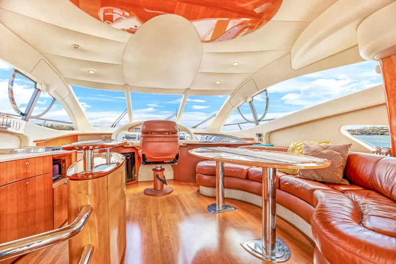  Yacht Photos Pics Luxurious interior of a 2005 Azimut 55E yacht with leather seating and panoramic windows.