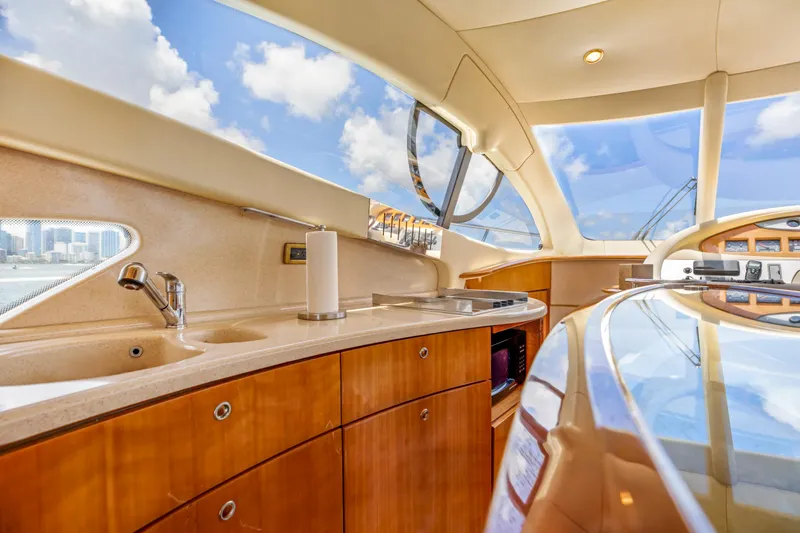  Yacht Photos Pics Luxurious interior of 2005 Azimut 55E yacht with modern kitchen amenities.