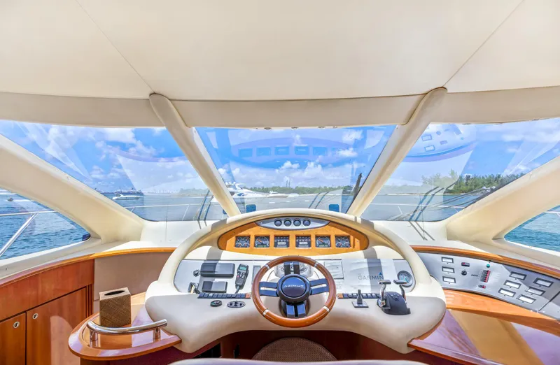  Yacht Photos Pics 2005 Azimut 55E yacht helm with panoramic ocean view and modern controls.