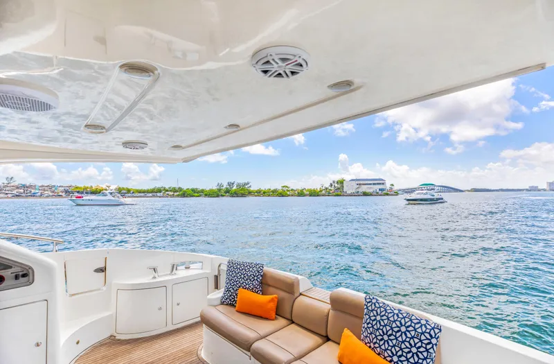  Yacht Photos Pics 2005 Azimut 55E yacht interior with ocean view, featuring comfortable seating and vibrant cushions.