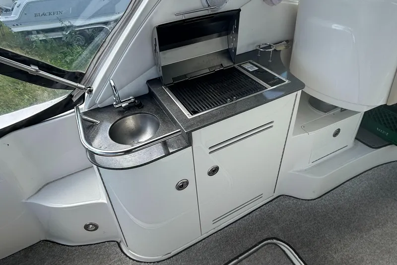Westwind Yacht Photos Pics 2012 Sea Ray 350 Sundancer boat kitchenette with sink and grill.