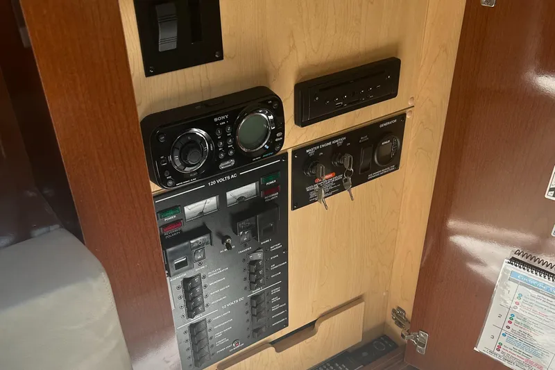 Westwind Yacht Photos Pics Control panel of 2012 Sea Ray 350 Sundancer boat with audio system and switches.