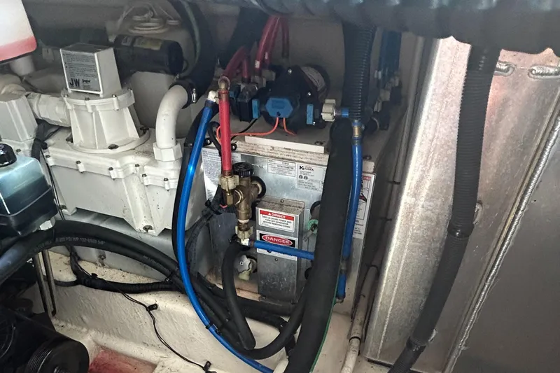 Westwind Yacht Photos Pics Engine compartment of a 2012 Sea Ray 350 Sundancer with visible wiring and components.