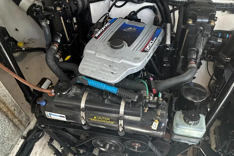 Westwind Yacht Photos Pics Engine compartment of a 2012 Sea Ray 350 Sundancer boat, showcasing mechanical components.
