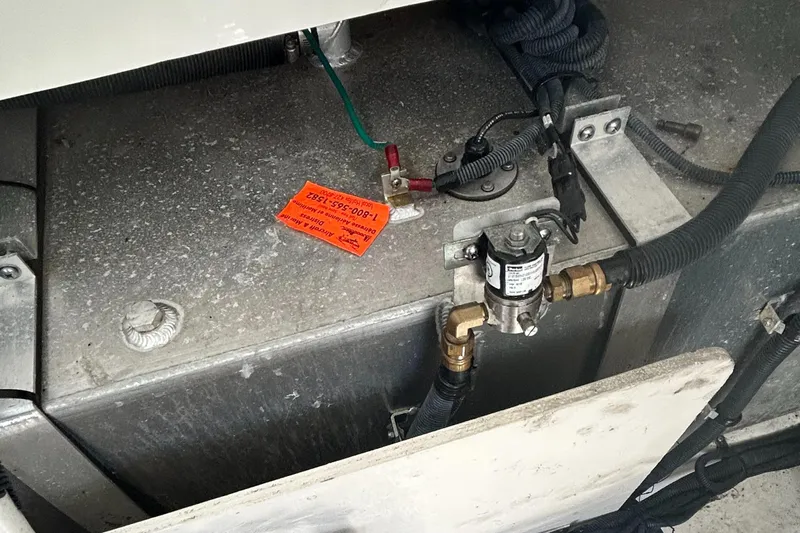 Westwind Yacht Photos Pics Engine compartment of a 2012 Sea Ray 350 Sundancer boat, showing wiring and components.