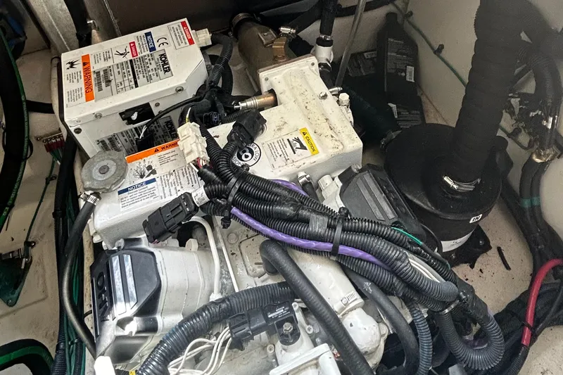 Westwind Yacht Photos Pics Engine compartment of a 2012 Sea Ray 350 Sundancer with visible wiring and components.