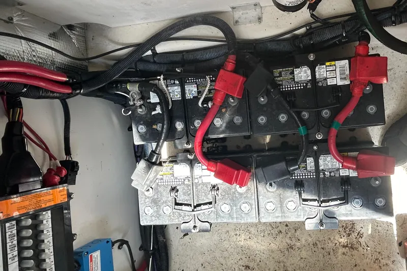 Westwind Yacht Photos Pics Battery compartment of 2012 Sea Ray 350 Sundancer with wiring and connections visible.