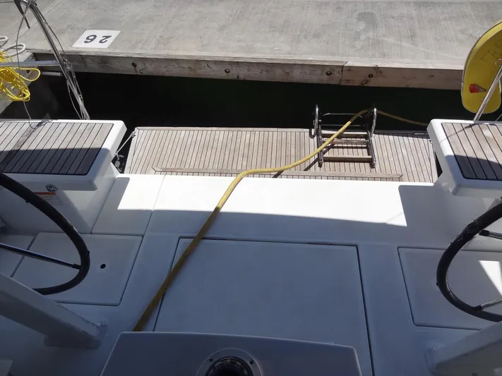 Tabula Rasa Yacht Photos Pics Beneteau Oceanis 46.1 2020 yacht stern view with dock and boarding ladder.