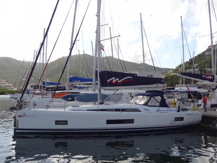 Tabula Rasa Yacht Photos Pics Beneteau Oceanis 46.1 2020 sailboat docked in a marina with scenic mountain backdrop.