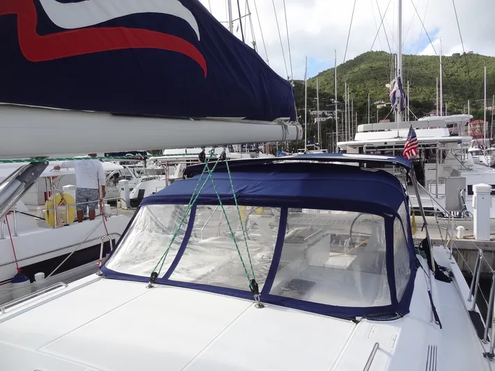 Tabula Rasa Yacht Photos Pics Beneteau Oceanis 46.1 2020 sailboat docked at marina with blue canopy.