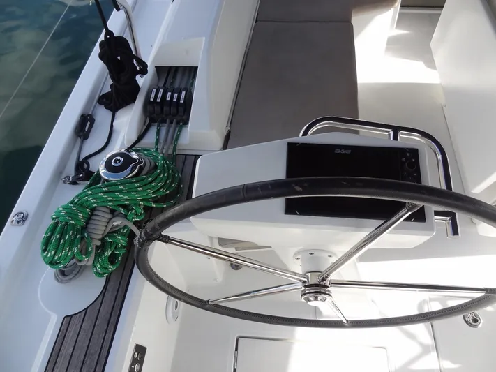 Tabula Rasa Yacht Photos Pics Beneteau Oceanis 46.1 2020 yacht helm station with steering wheel and green ropes.