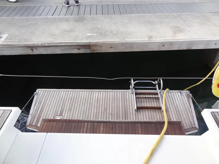 Tabula Rasa Yacht Photos Pics Beneteau Oceanis 46.1 2020 yacht stern with swim platform and ladder at dock.