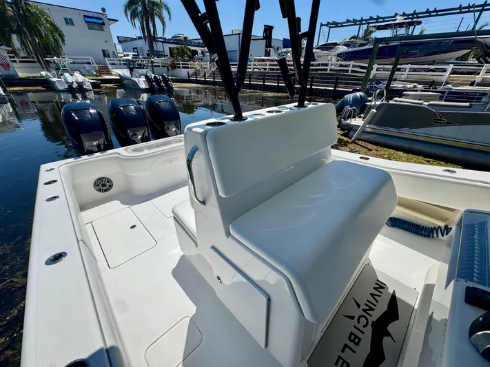  Yacht Photos Pics 2009 Invincible 36 Open Fisherman boat with triple outboard engines docked at marina.