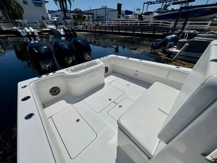  Yacht Photos Pics 2009 Invincible 36 Open Fisherman boat with triple outboard engines docked at marina.