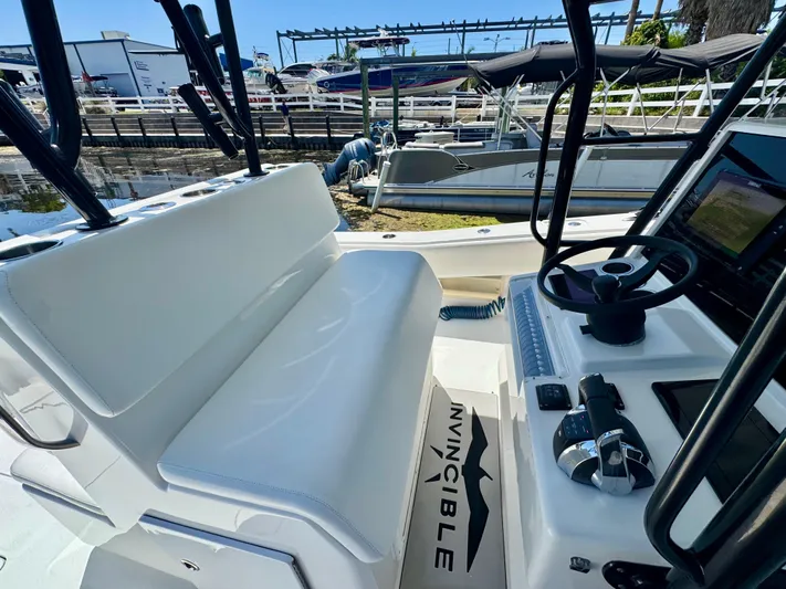  Yacht Photos Pics 2009 Invincible 36 Open Fisherman boat interior with steering wheel and seating area.