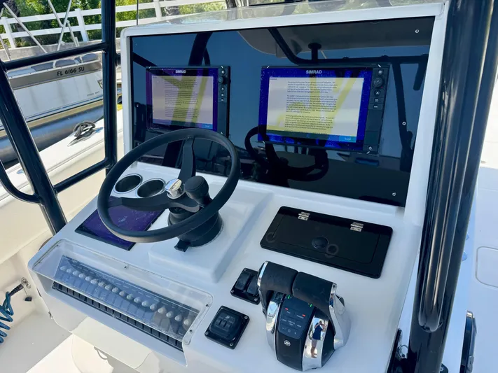  Yacht Photos Pics 2009 Invincible 36 Open Fisherman dashboard with dual Simrad displays and controls.