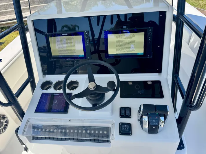  Yacht Photos Pics Control panel of 2009 Invincible 36 Open Fisherman boat with dual displays and steering wheel.