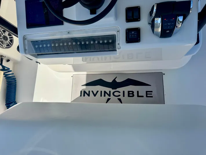  Yacht Photos Pics Control panel of 2009 Invincible 36 Open Fisherman boat with logo.