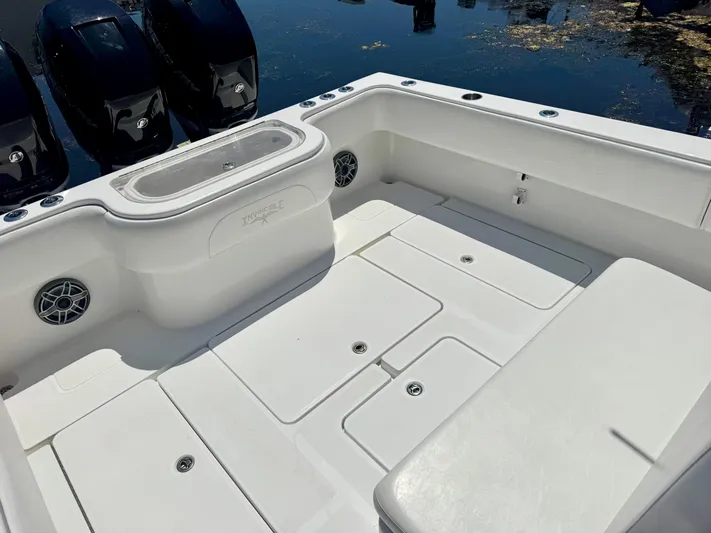  Yacht Photos Pics 2009 Invincible 36 Open Fisherman boat deck with seating and storage compartments.