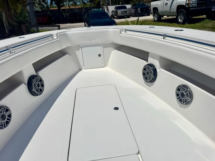  Yacht Photos Pics 2009 Invincible 36 Open Fisherman boat interior with speakers and storage compartments.