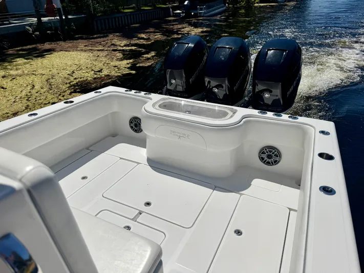  Yacht Photos Pics 2009 Invincible 36 Open Fisherman boat with triple outboard engines on water.