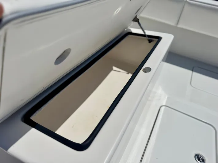  Yacht Photos Pics Open storage compartment on a 2009 Invincible 36 Open Fisherman boat.
