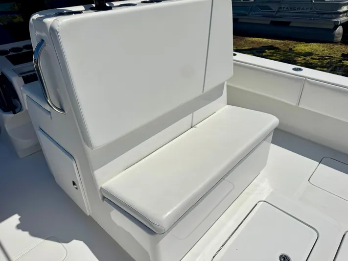 Yacht Photos Pics White seating on 2009 Invincible 36 Open Fisherman boat, showcasing clean design and comfort.