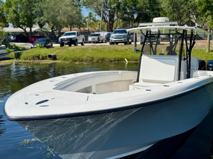  Yacht Photos Pics 2009 Invincible 36 Open Fisherman boat docked by a scenic waterfront.